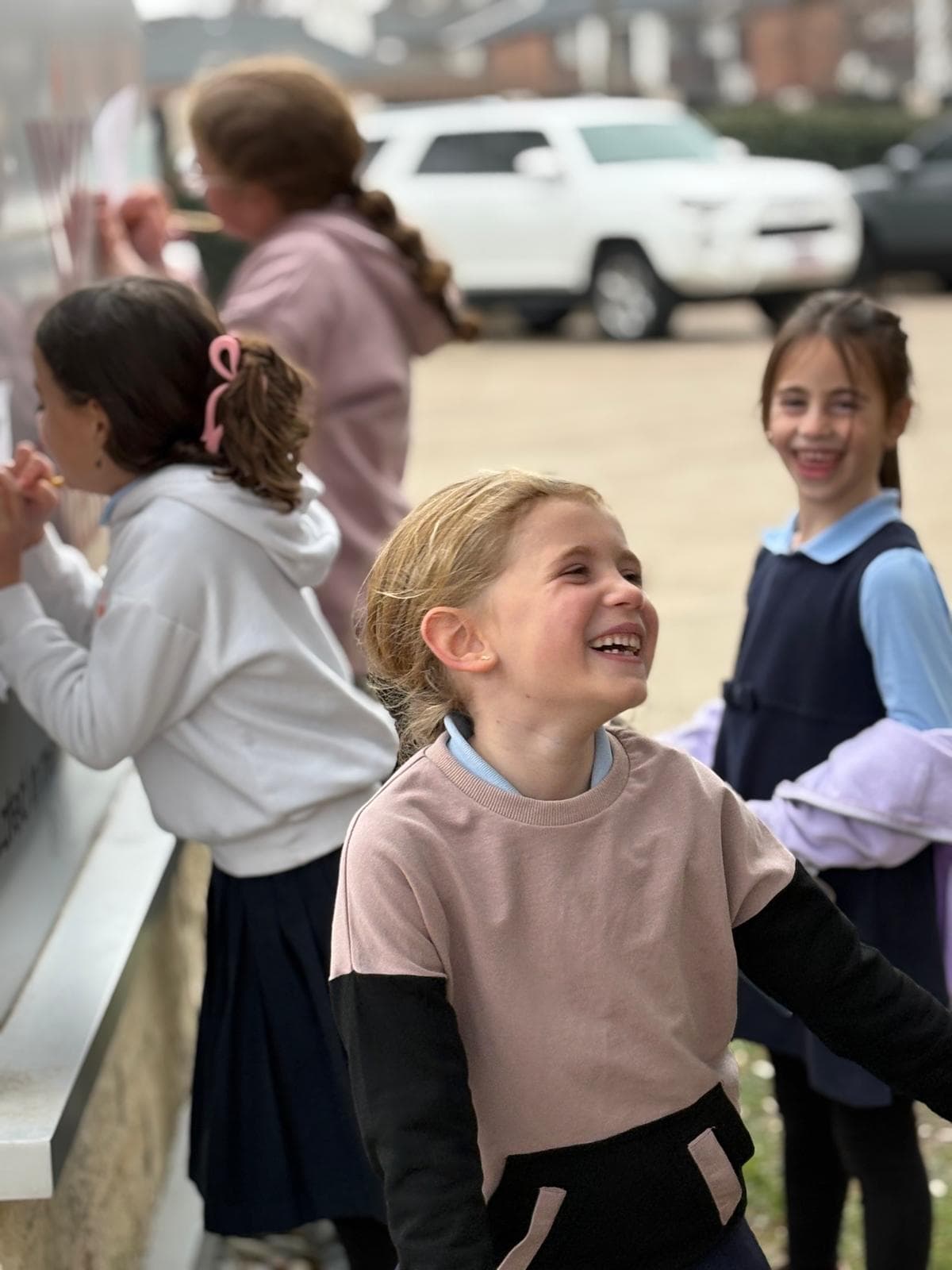 A Cheder Lubavitch Dallas student laughing with friends